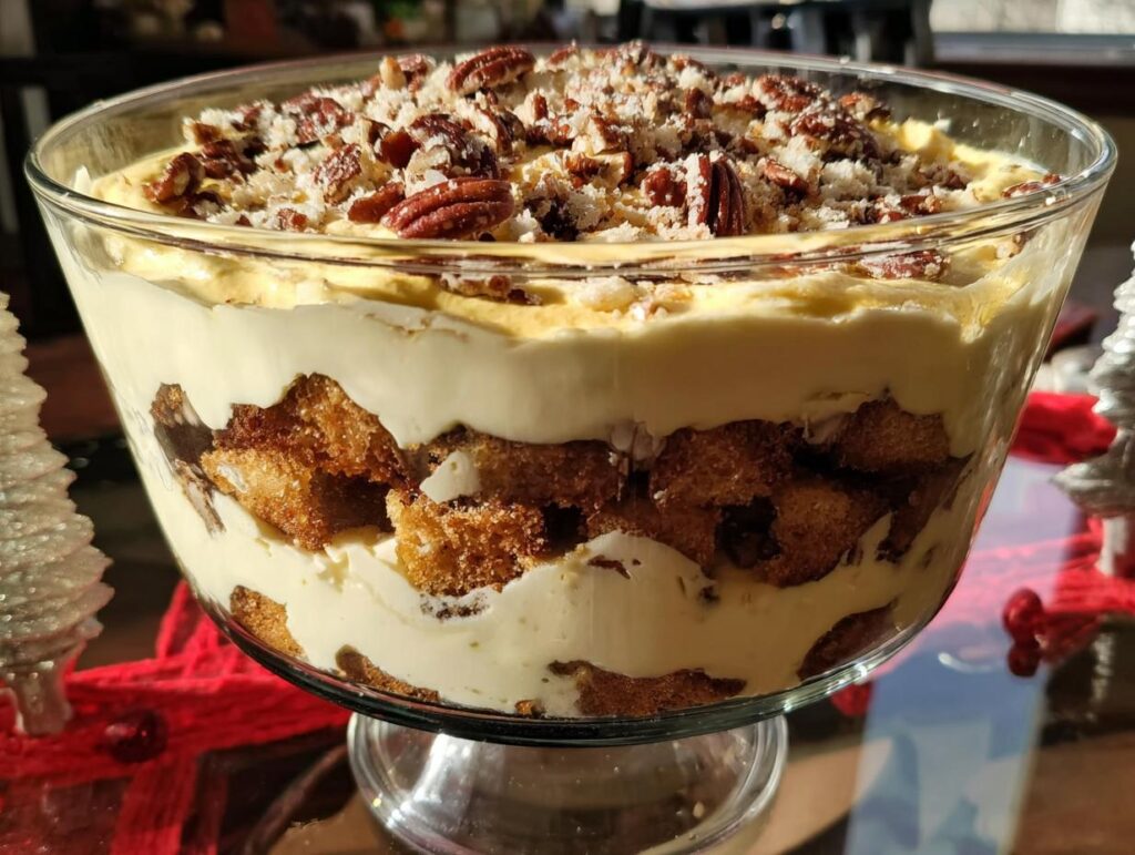 A layered trifle dessert with creamy filling, cake pieces, and a pecan topping, perfect for 5-Ingredient Thanksgiving Desserts.