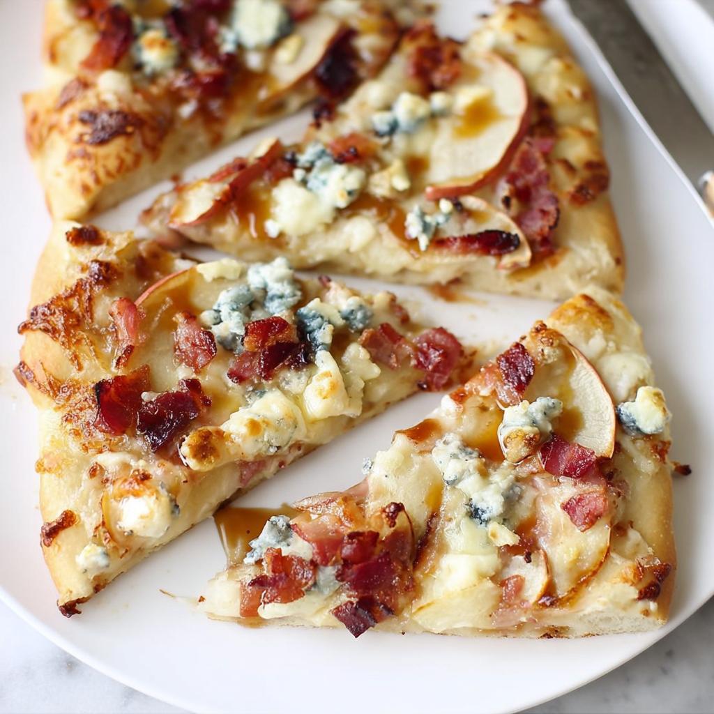 Close-up of a slice of apple, bacon, and blue cheese pizza, part of 10-Ingredient Pizza Night Recipes.