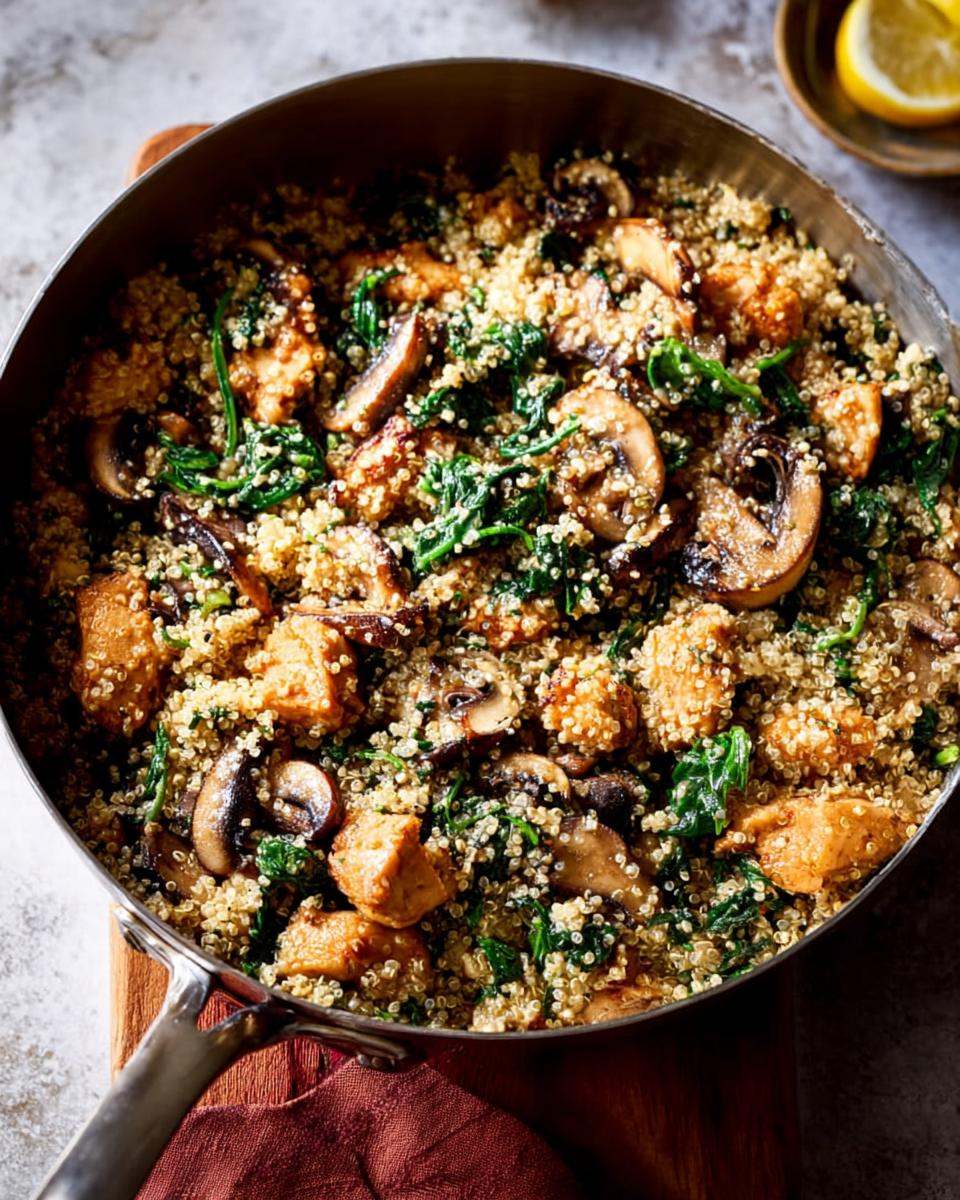 A healthy skillet meal featuring chicken, quinoa, mushrooms, and spinach, perfect for beginners.