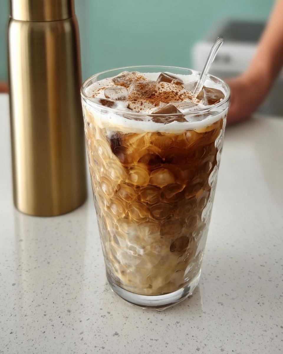 A refreshing iced coffee drink with cream and cinnamon, perfect for Starbucks Drinks Recipes.