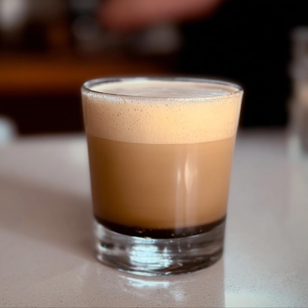 A refreshing glass of iced coffee with a layer of foam, perfect for busy weeknights.