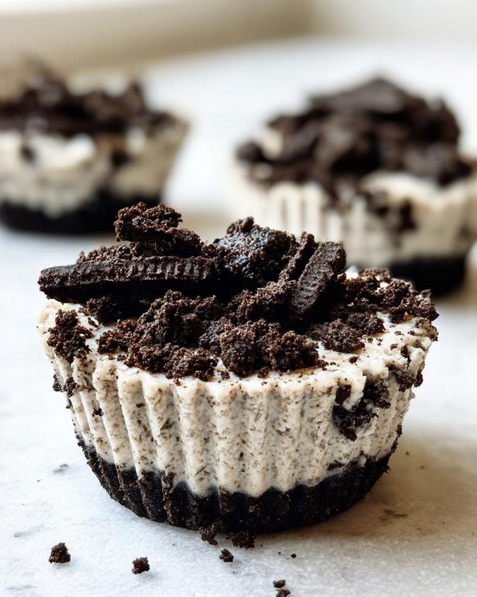 Close-up of a Healthy No-Bake Oreo Cheesecake Bite, topped with crushed Oreos and cookie pieces.