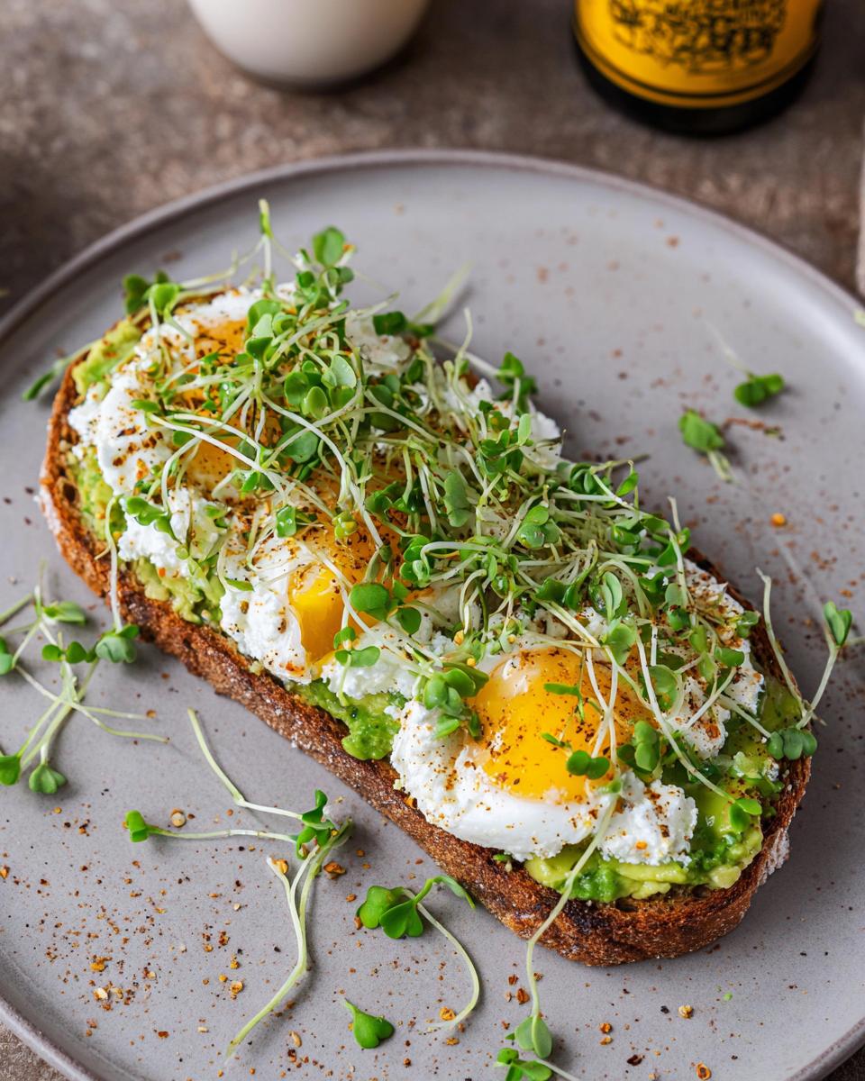A high-protein breakfast wrap topped with mashed avocado, cottage cheese, poached eggs, and microgreens.